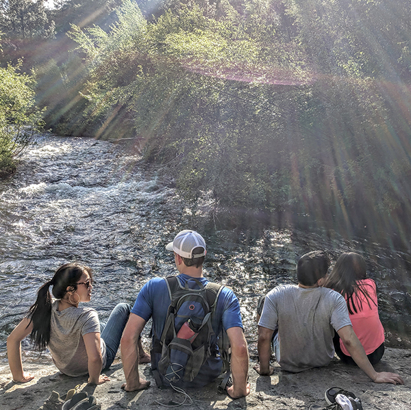 Hikers enjoy a break along Whychus Creek. Photo: Rane Johnson.