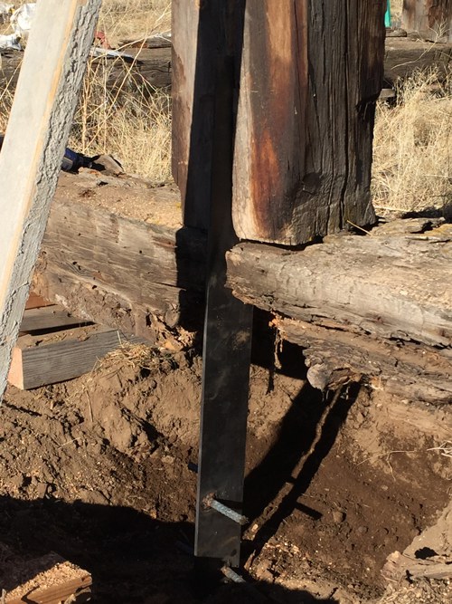 The metal brace slides into the notched post. Photo: Land Trust.