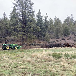 A tractor stands ready to move trees for the Willow Springs Preserve restoration. Photo: Land Trust.