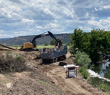 Crews work on building a large habitat structure at Ochoco Preserve. Photo: Land Trust.