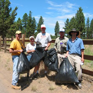 Volunteers pull weeds at Camp Polk Meadow Preserve in 2004. Photo: Land Trust.