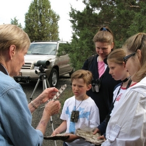 Norma Funai talks to group about feathers. Photo: Land Trust.