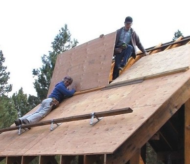 Judy and Jim help with the construction of the kiosk at the Metolius Preserve. Photo: Land Trust.