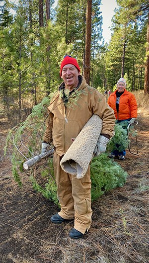 A happy tree hunter with his trusty cutting carpet. Photo: Joan Amero.