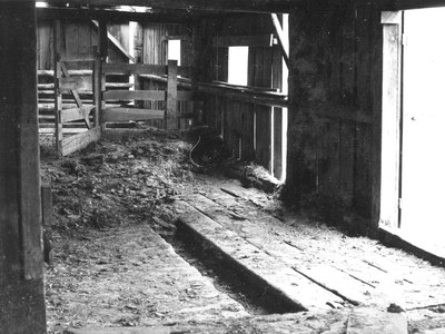 Wooden gutter in the floor of the Hindman Barn. Photo: Ed Barnum.