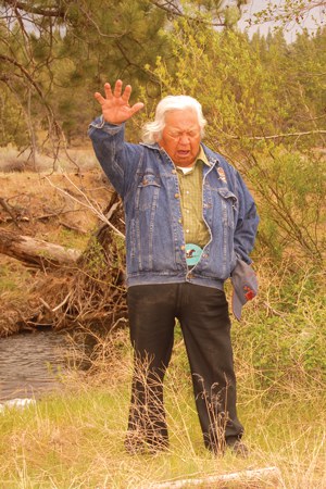 In 2007 at Camp Polk Meadow Preserve, Confederated Tribes of Warm Springs Chief Delvis Heath offered a blessing to celebrate the first steelhead to be released in Whychus Creek in 50 years. Photo: John Hutmacher.
